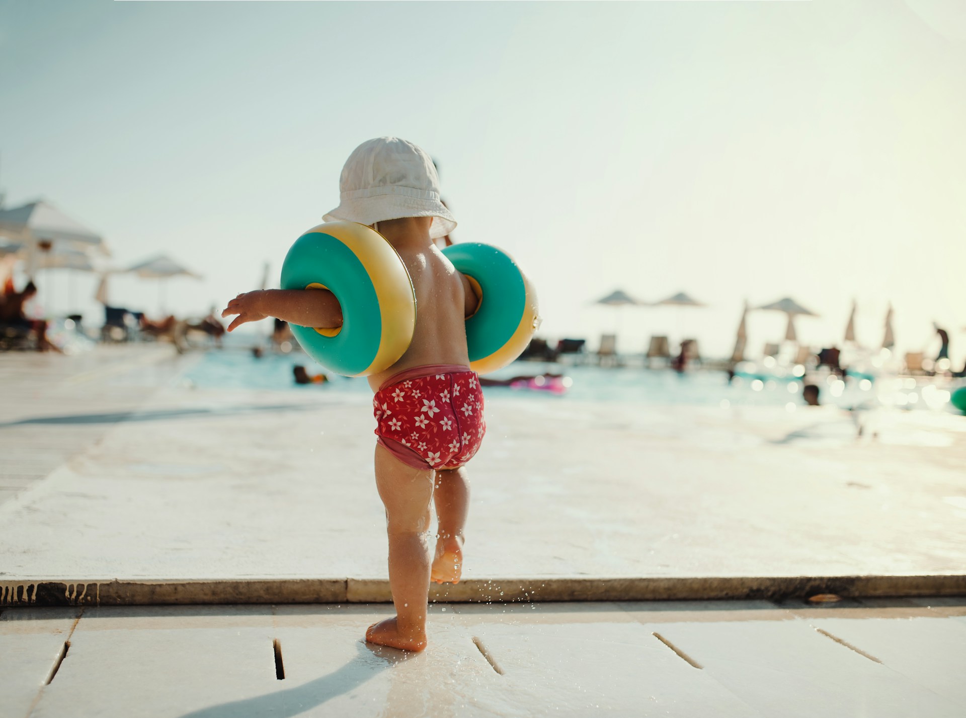 small child walking on beach