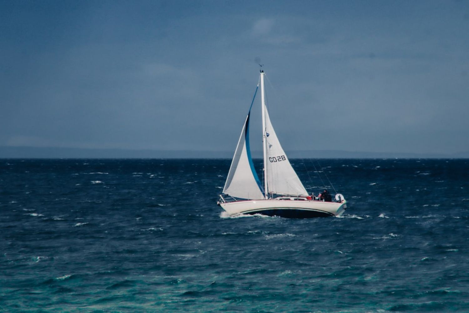 Sailing Trip - a sailboat in the middle of the ocean