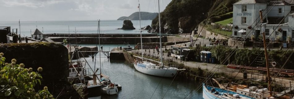 Boat Cornwall - a group of boats that are sitting in the water