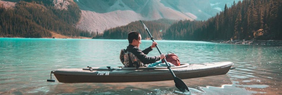 Kayaking - Person Riding on Gray Kayak