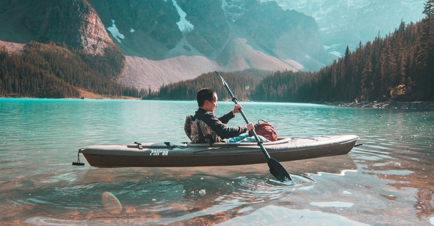 Kayaking - Person Riding on Gray Kayak