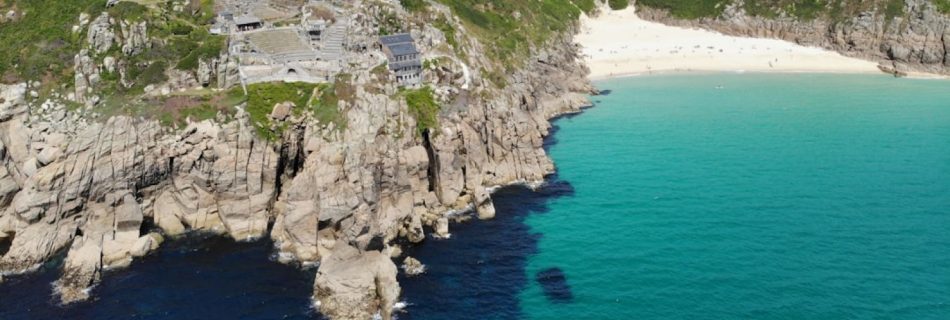 Cornwall - village near cliff and body of water under white clouds