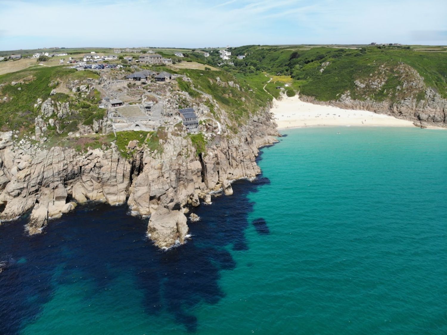 Cornwall - village near cliff and body of water under white clouds