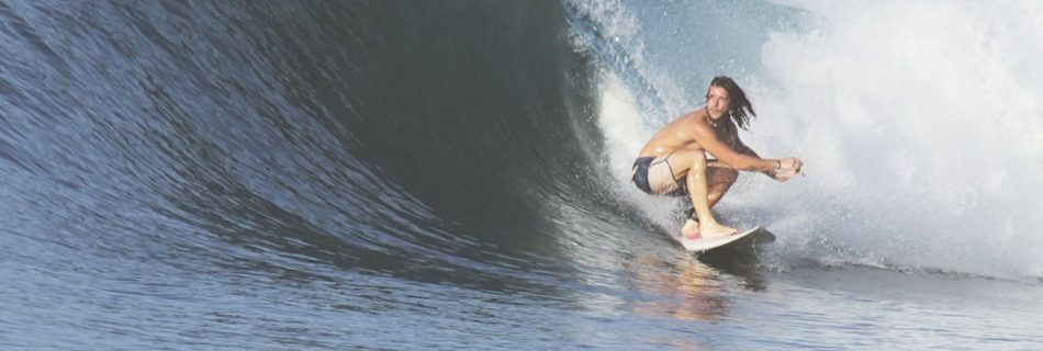 Surfing - man surfing with big wave