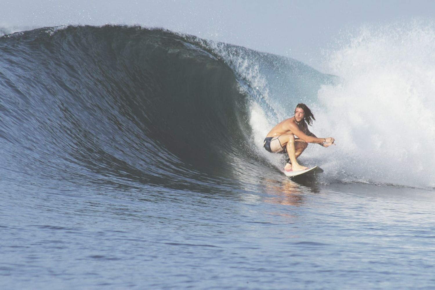 Surfing - man surfing with big wave