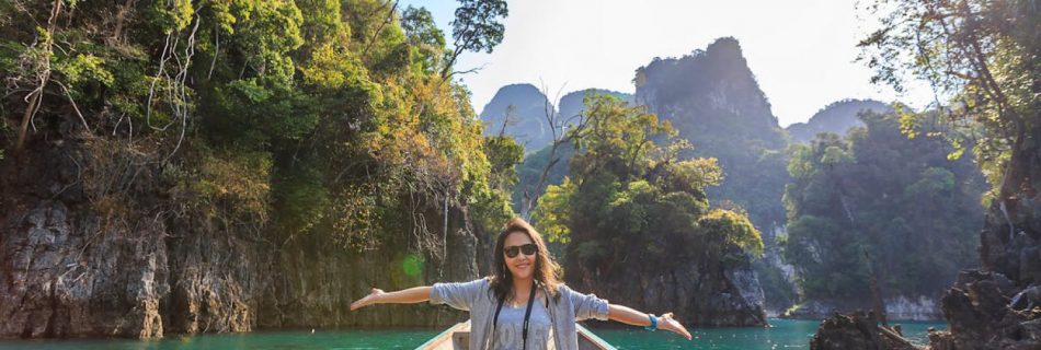 Boat Tour Experience - Photo of Woman Sitting on Boat Spreading Her Arms