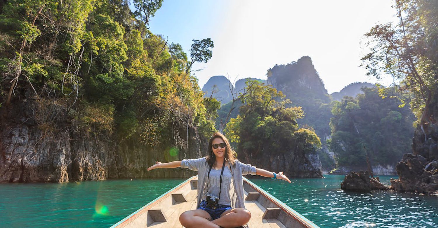 Boat Tour Experience - Photo of Woman Sitting on Boat Spreading Her Arms