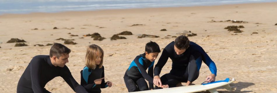 Surfing Lesson - Mend and Kids Cleaning Surfboards