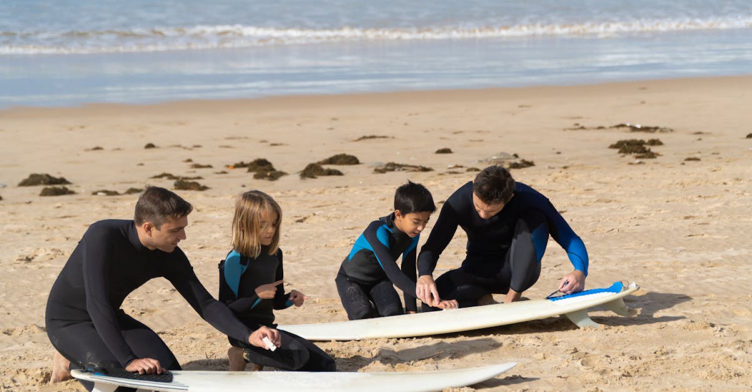 Surfing Lesson - Mend and Kids Cleaning Surfboards