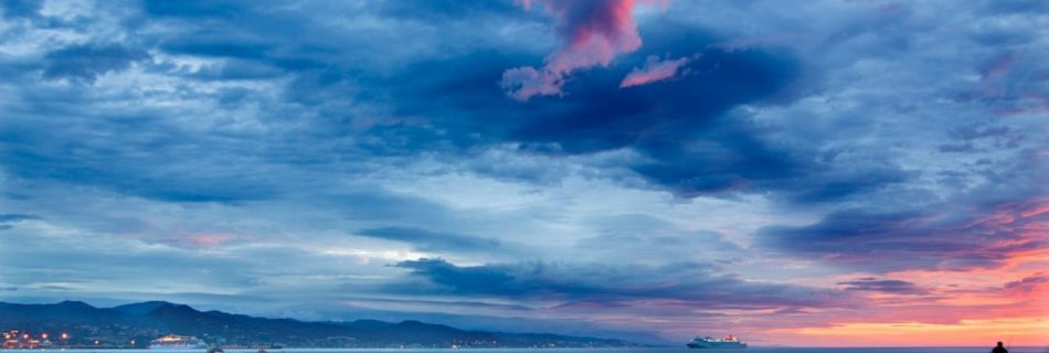 Sunset Cruises - silhouette person standing beside body of water