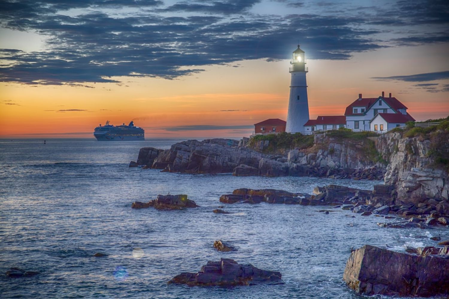 Sunset Cruises - red and white lighthouse on cliff