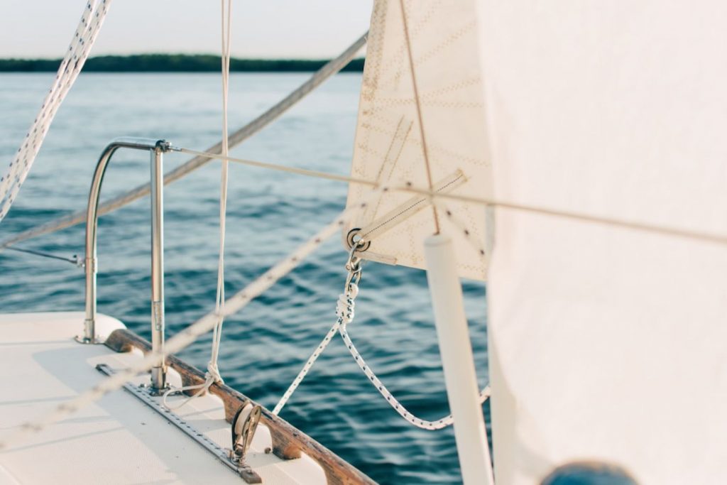 Sailing - white and gray boat on body of water