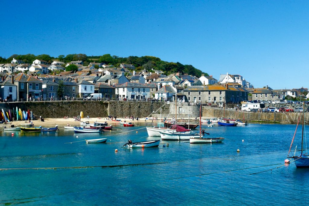 white and blue boats on sea dock during daytime